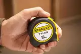 Рулетка вимірювальна Tylon ™ довжиною 5 м, шириною 19 мм, в пластмасовому корпусі STANLEY 0-30-697 — Photo 28